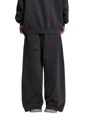 STILL. Vintage Washed Tape Raw Edge Sweatpants, worn by a model