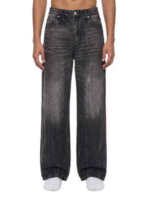 STILL. Men's Vintage Wash Wide Leg Jeans, worn by a model