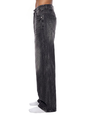 STILL. Men's Vintage Wash Wide Leg Jeans, worn by a model