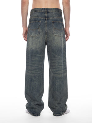 STILL. Men's Pleated Wide Leg Jeans, worn by a model