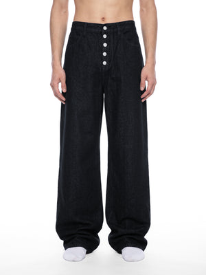 STILL. Men's Button Fly Wide Leg Jeans, worn by a model