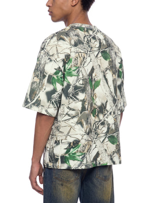 STILL. Unisex Tree Camo Boxy T-Shirt, worn by a model