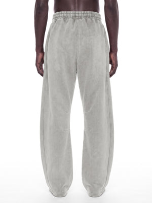 STILL. Unisex Vintage Wash Barrel Leg Fleece Sweatpants, worn by a model