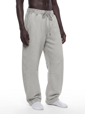 STILL. Unisex Vintage Wash Barrel Leg Fleece Sweatpants, worn by a model