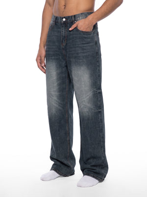 STILL. Men's Knee Fade Straight Leg Jeans, worn by a model