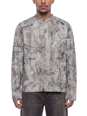 STILL. Unisex Tree Camo Waffle Long Sleeve T-Shirt, worn by a model