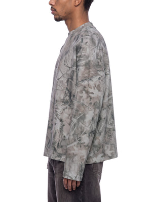 STILL. Unisex Tree Camo Waffle Long Sleeve T-Shirt, worn by a model