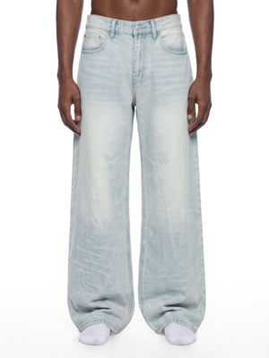 STILL. Men's Light Wash Wide Leg Jeans, worn by a model