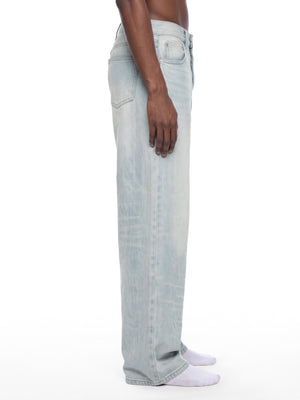 STILL. Men's Light Wash Wide Leg Jeans, worn by a model