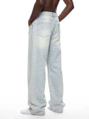 STILL. Men's Light Wash Wide Leg Jeans, worn by a model