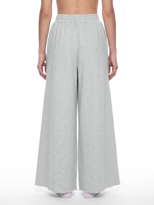 STILL. Women's Raw Edge Wide Leg Sweatpants, worn by a model