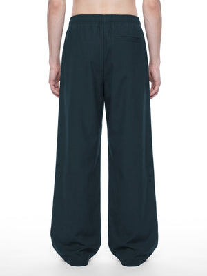 STILL. Men's Loose Straight Leg Pants, worn by a model