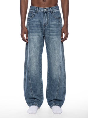 STILL. Unisex Vintage Wash Barrel Leg Jeans, worn by a model