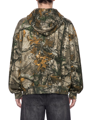 STILL. Unisex Waffle Tree Camo Boxy Hoodie, worn by a model