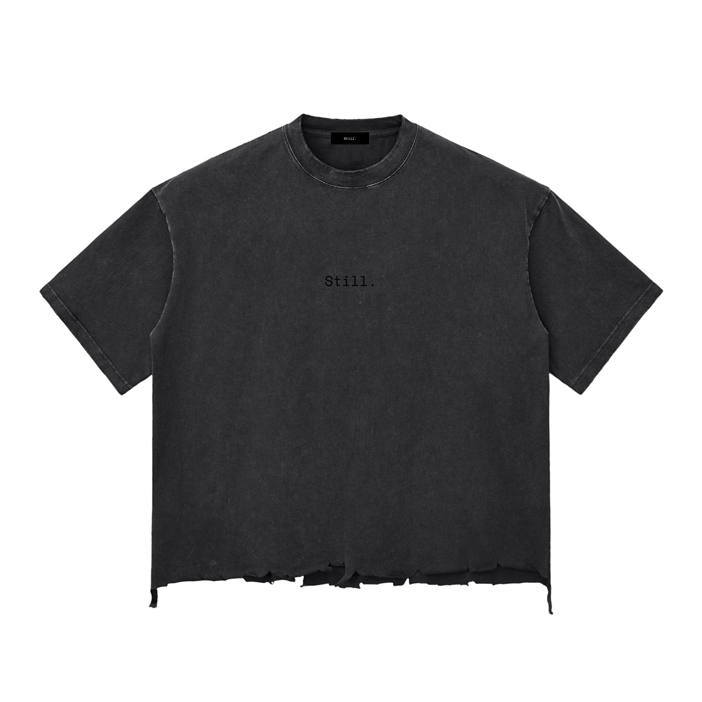 Black t-shirt with 'Still.' text on a white background