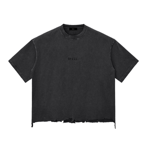 Black t-shirt with 'Still.' text on a white background