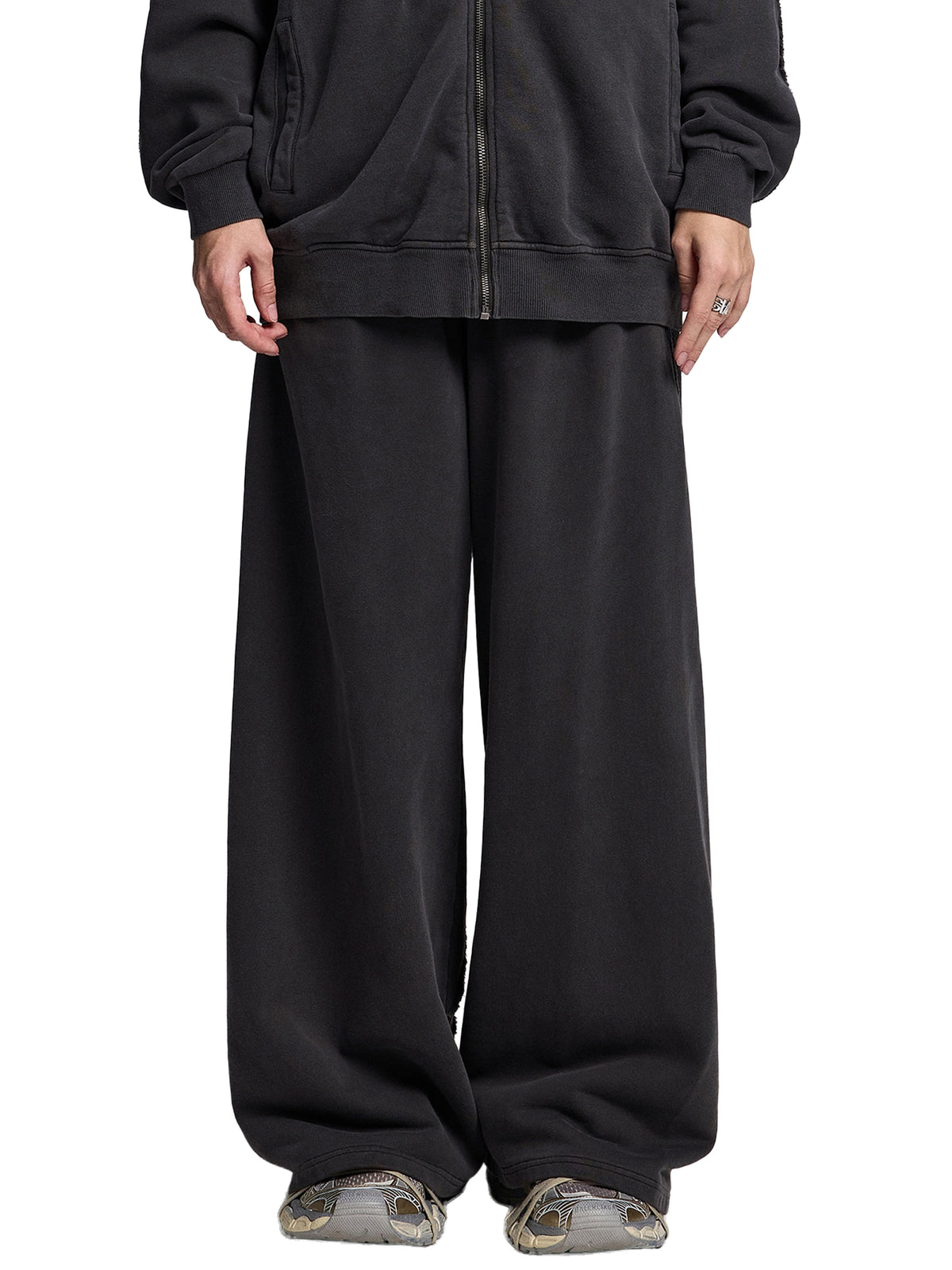 STILL. Vintage Washed Tape Raw Edge Sweatpants, worn by a model