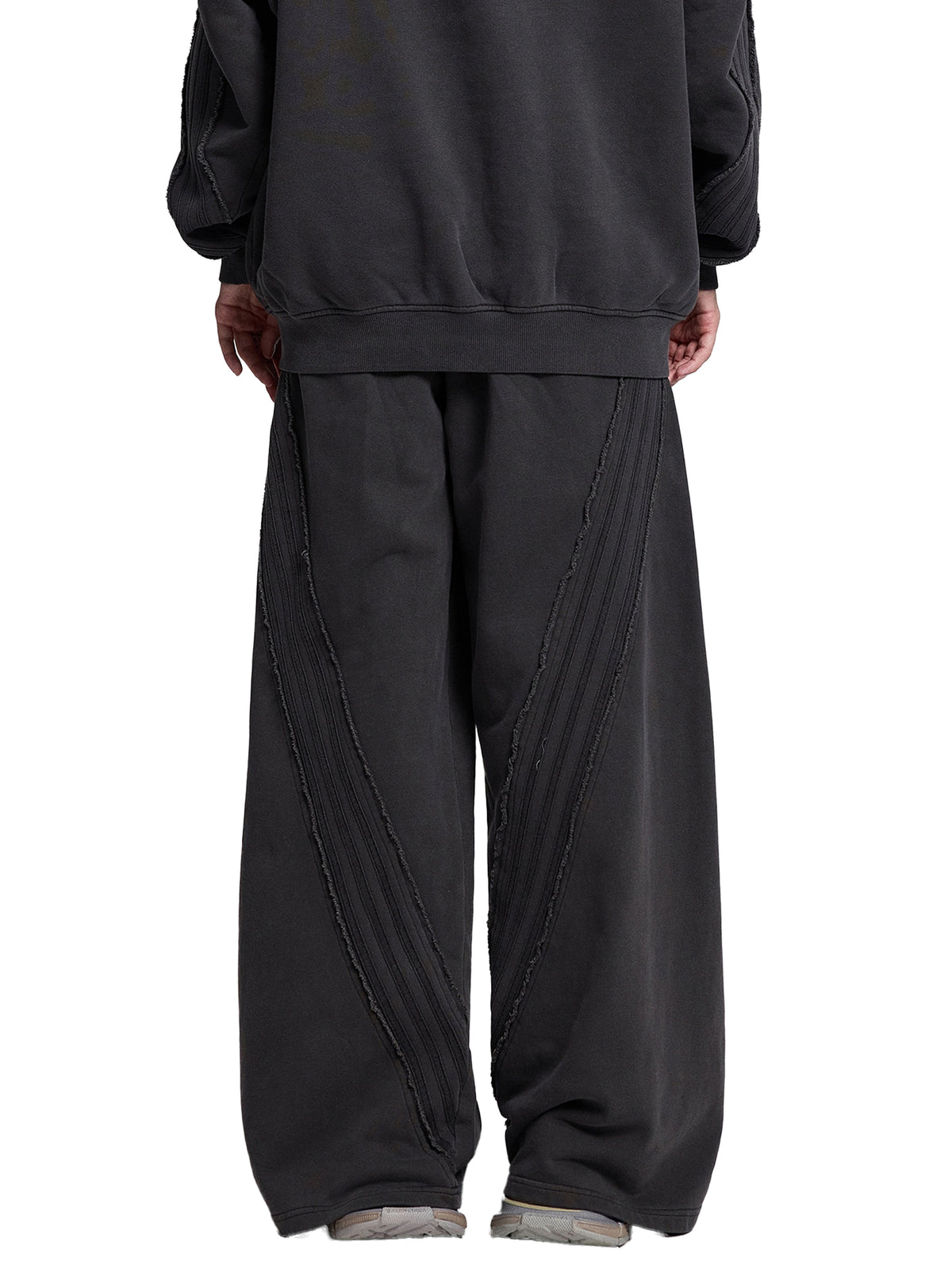 STILL. Vintage Washed Tape Raw Edge Sweatpants, worn by a model