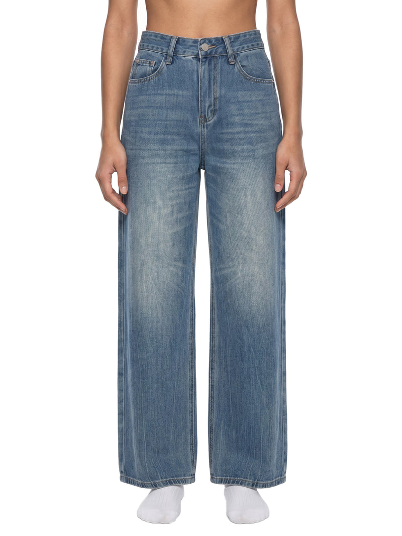 STILL. Women's Vintage Wash Wide Leg Jeans, worn by a model