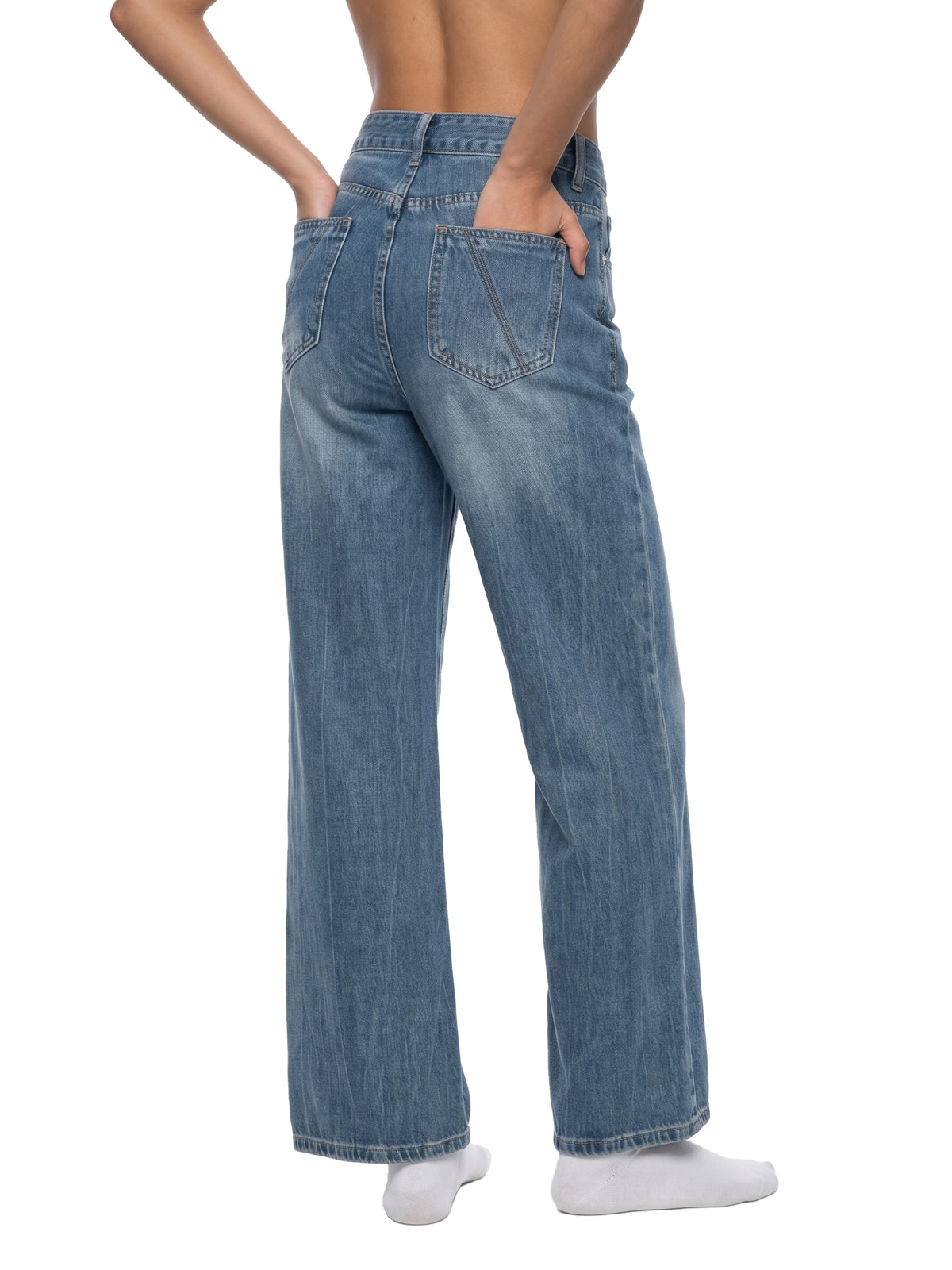 STILL. Women's Vintage Wash Wide Leg Jeans, worn by a model