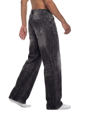 STILL. Men's Vintage Wash Wide Leg Jeans, worn by a model