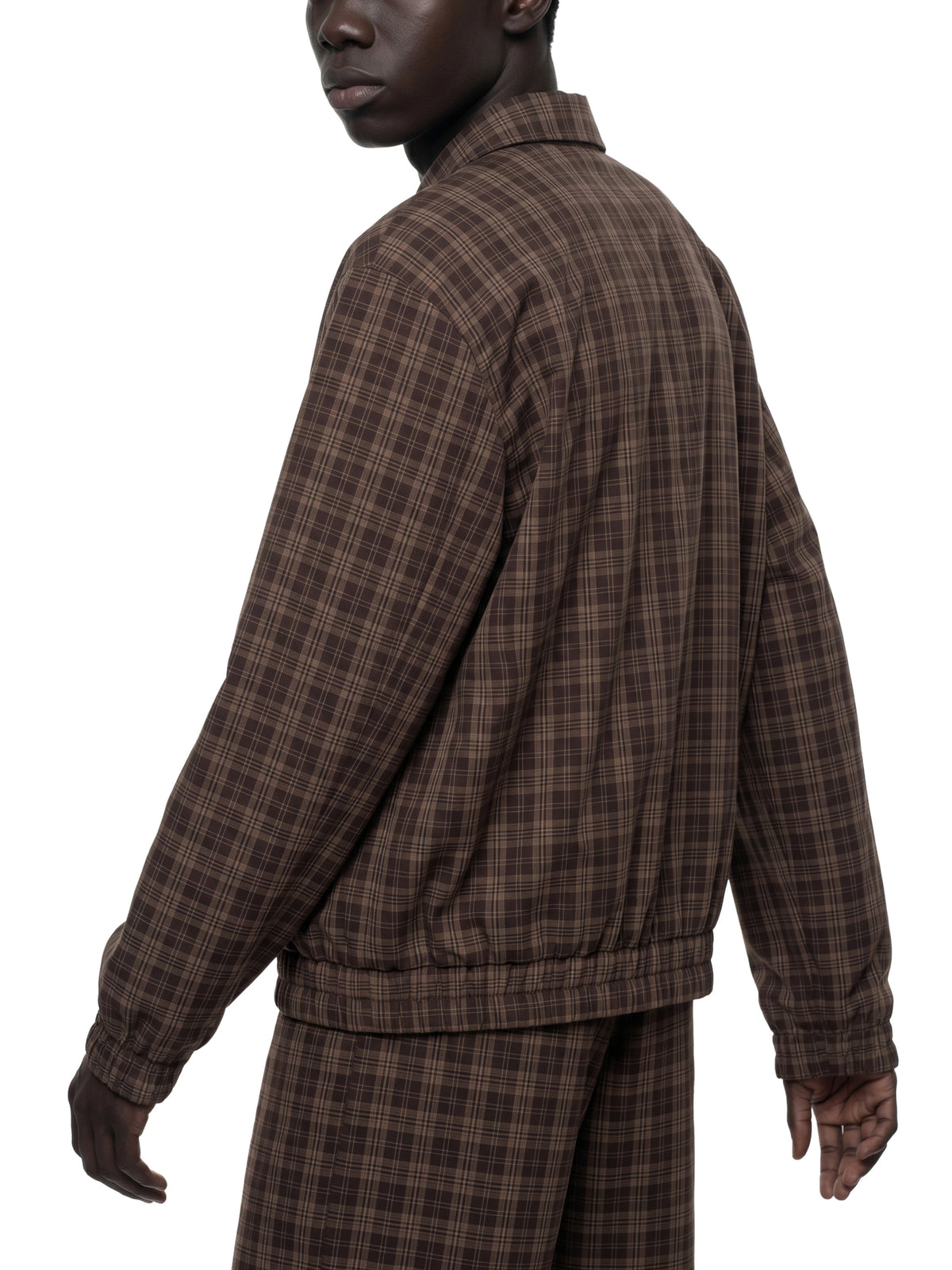 STILL. Plaid Zip Track Jacket, worn by a model