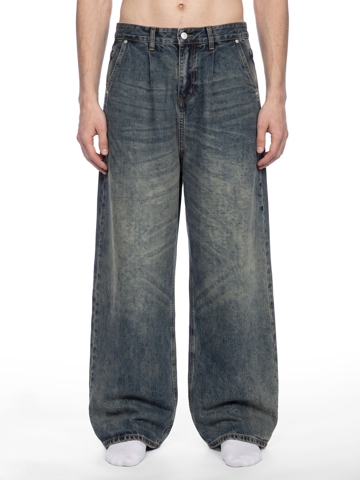 STILL. Men's Pleated Wide Leg Jeans, worn by a model