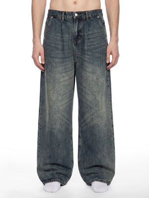 STILL. Men's Pleated Wide Leg Jeans, worn by a model