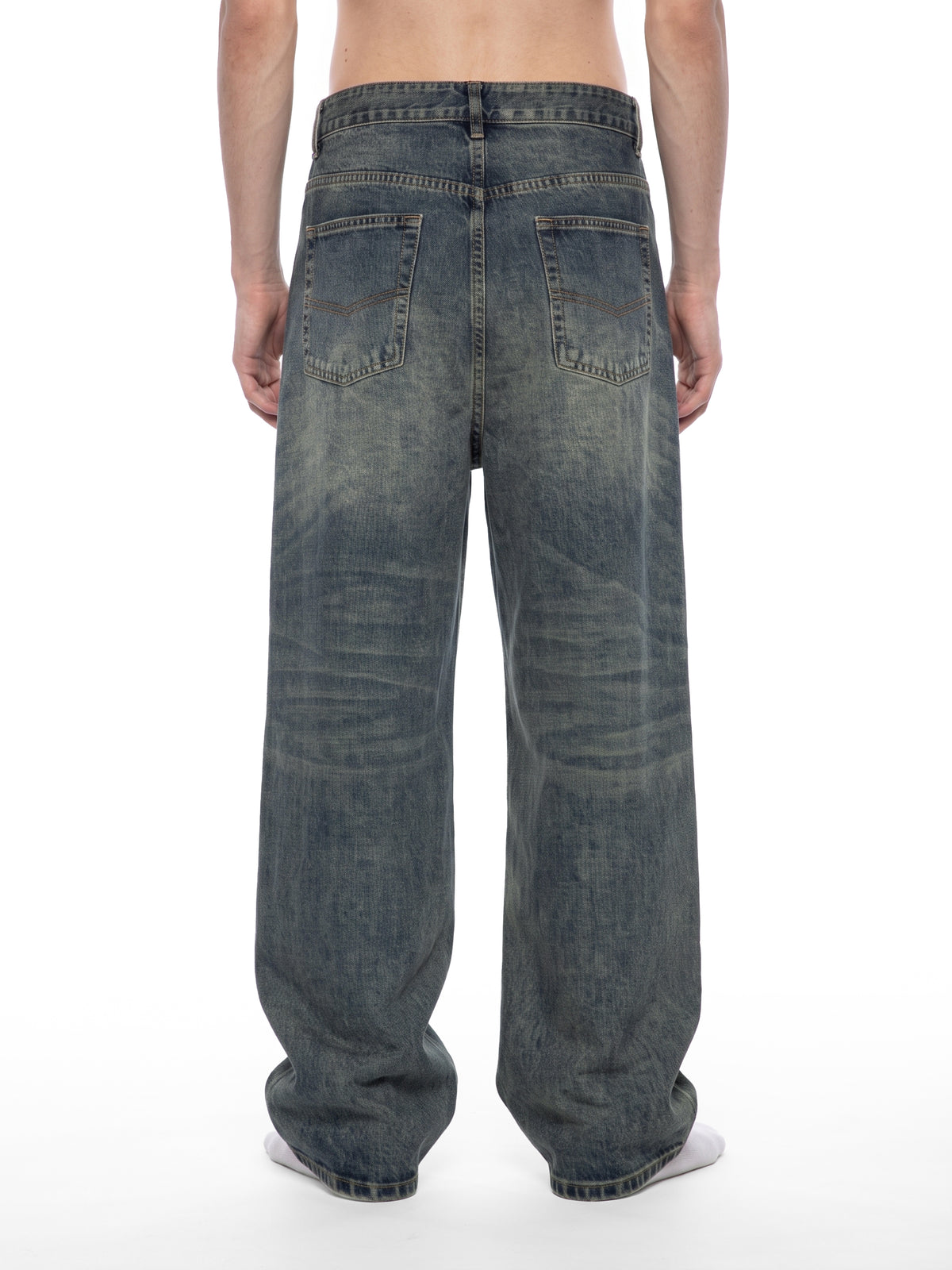 STILL. Men's Pleated Wide Leg Jeans, worn by a model
