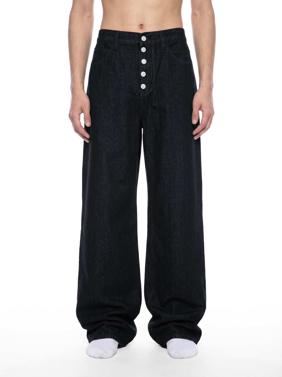 STILL. Men's Button Fly Wide Leg Jeans, worn by a model
