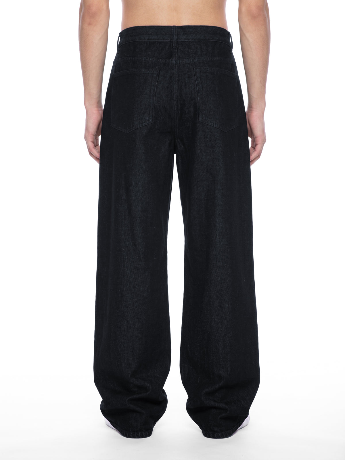 STILL. Men's Button Fly Wide Leg Jeans, worn by a model