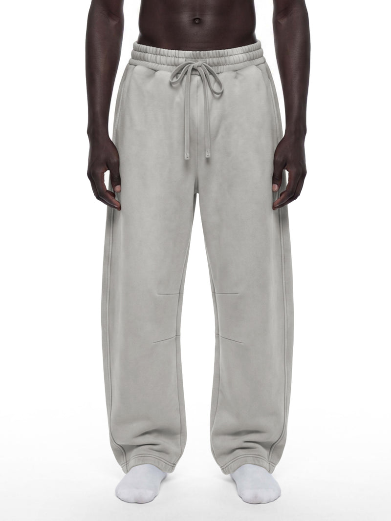 STILL. Unisex Vintage Wash Barrel Leg Fleece Sweatpants, worn by a model