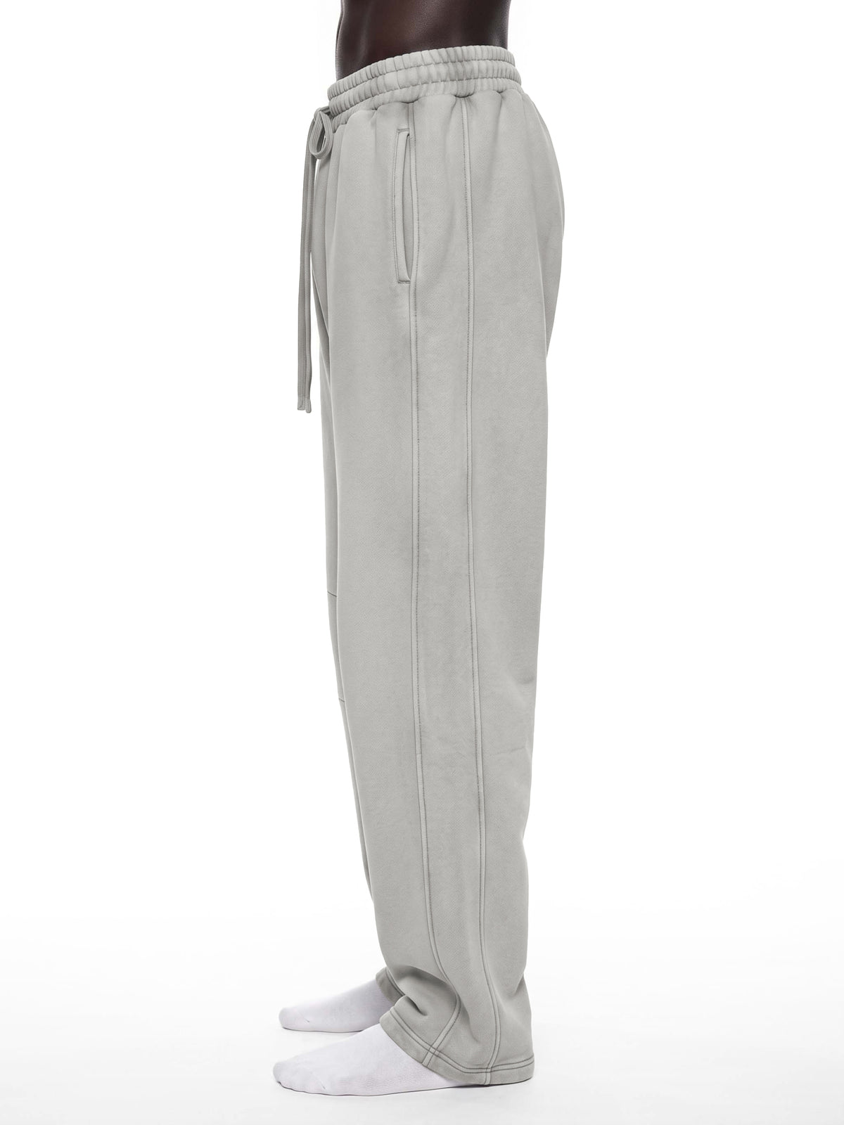 STILL. Unisex Vintage Wash Barrel Leg Fleece Sweatpants, worn by a model