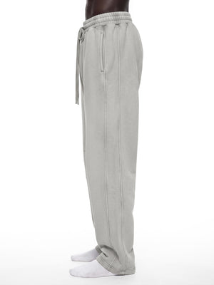 STILL. Unisex Vintage Wash Barrel Leg Fleece Sweatpants, worn by a model