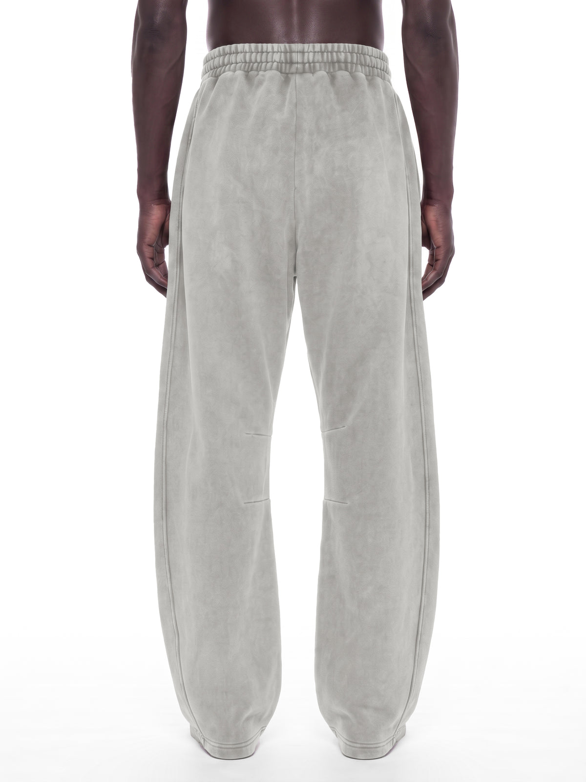 STILL. Unisex Vintage Wash Barrel Leg Fleece Sweatpants, worn by a model