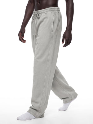 STILL. Unisex Vintage Wash Barrel Leg Fleece Sweatpants, worn by a model