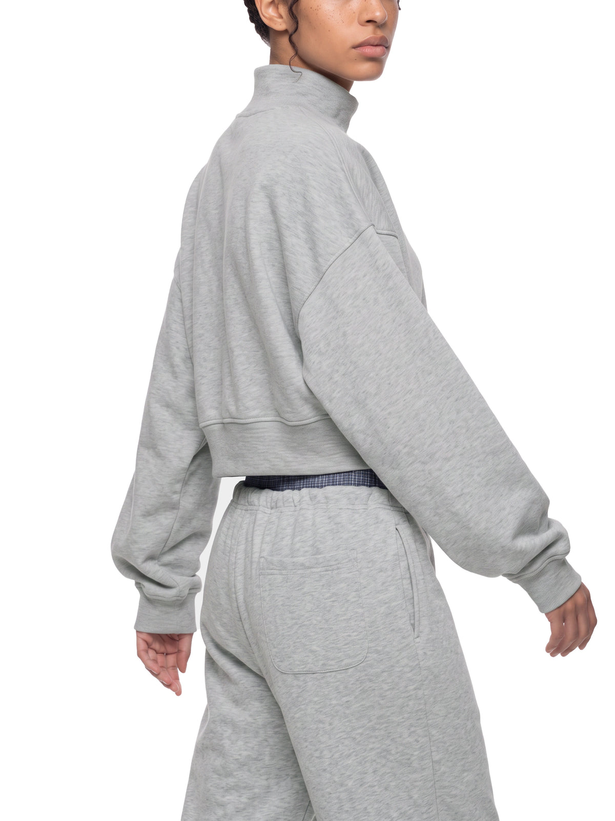 STILL. Women's Crop Mock Neck Sweatshirt, worn by a model