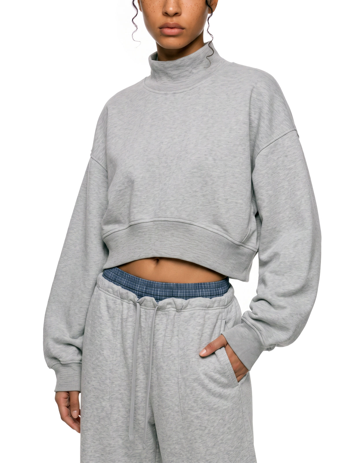 STILL. Women's Crop Mock Neck Sweatshirt, worn by a model
