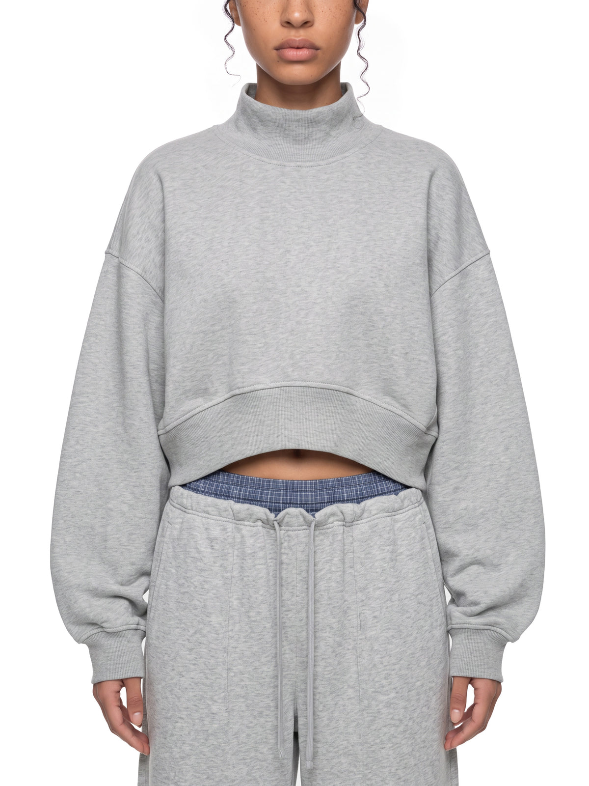 STILL. Women's Crop Mock Neck Sweatshirt, worn by a model