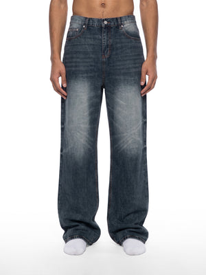 STILL. Men's Knee Fade Straight Leg Jeans, worn by a model