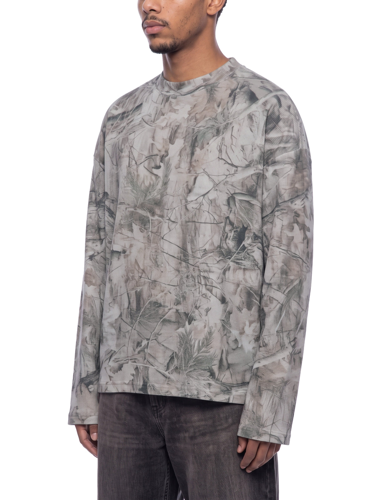 STILL. Unisex Tree Camo Waffle Long Sleeve T-Shirt, worn by a model