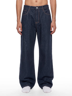 STILL. Men's Dark Indigo Loose Jeans, worn by a model