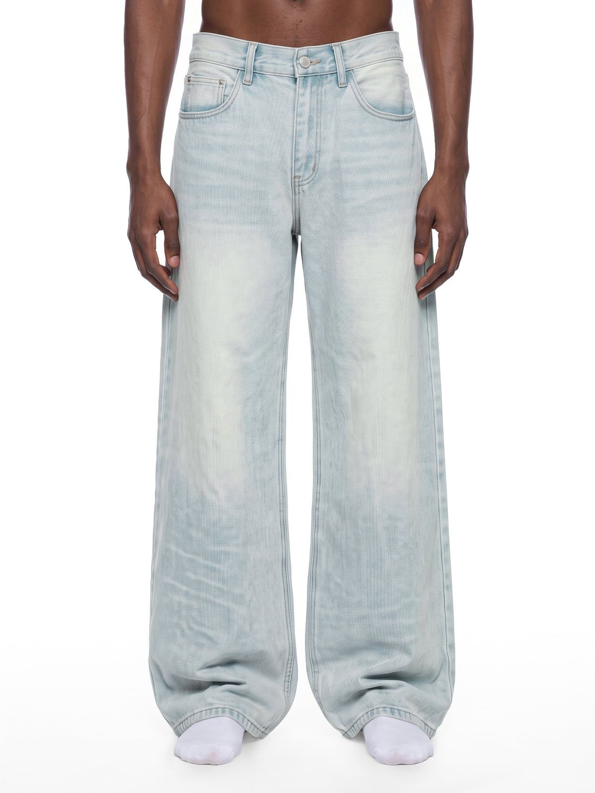 STILL. Men's Light Wash Wide Leg Jeans, worn by a model