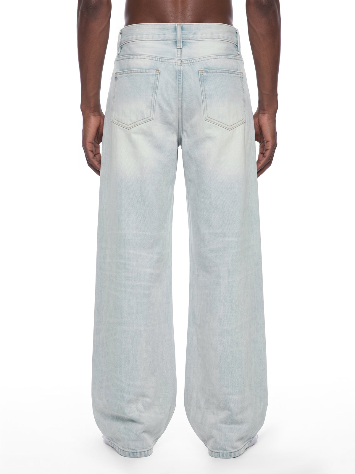 STILL. Men's Light Wash Wide Leg Jeans, worn by a model