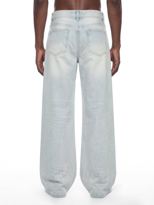 STILL. Men's Light Wash Wide Leg Jeans, worn by a model