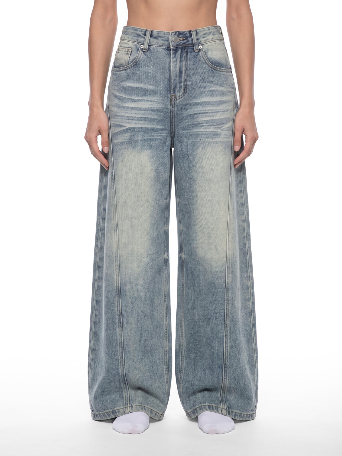 STILL. Women's Panelled Wide Leg Jeans, worn by a model