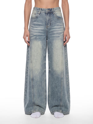STILL. Women's Panelled Wide Leg Jeans, worn by a model