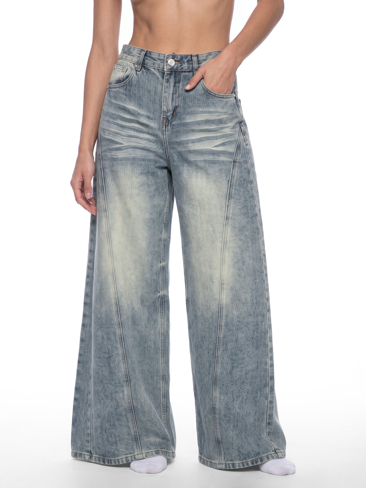STILL. Women's Panelled Wide Leg Jeans, worn by a model