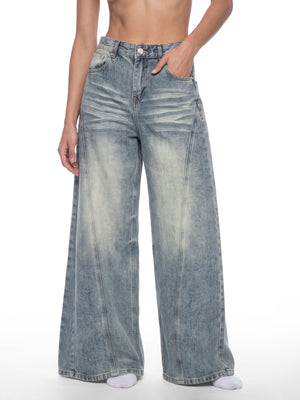 STILL. Women's Panelled Wide Leg Jeans, worn by a model