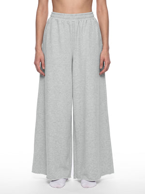 STILL. Women's Raw Edge Wide Leg Sweatpants, worn by a model